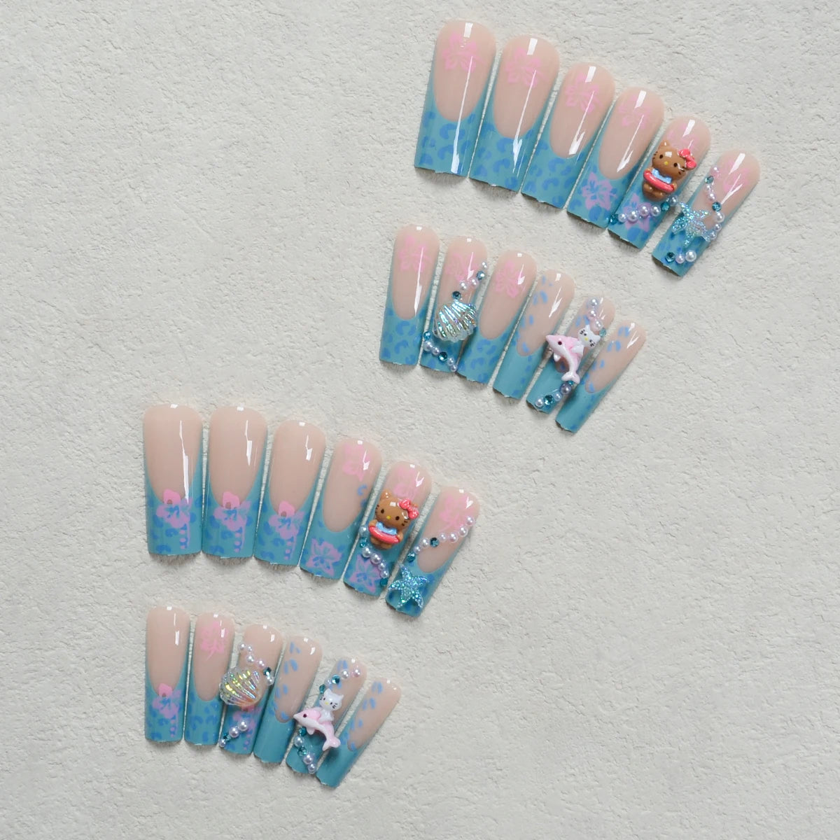 24Pcs Long Coffin-Shaped Nail Stickers in Blue and Pink Gradient, Sanrio French Style Hello Kitty 3D Shell and Starfish Rhinestones, White Pearl Rhinestones, Press-On Nail Set Suitable for Women's Daily Wear and Parties (Incl