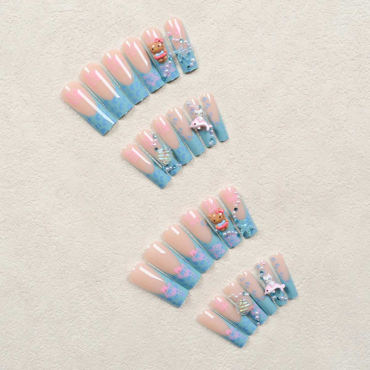 24Pcs Long Coffin-Shaped Nail Stickers in Blue and Pink Gradient, Sanrio French Style Hello Kitty 3D Shell and Starfish Rhinestones, White Pearl Rhinestones, Press-On Nail Set Suitable for Women's Daily Wear and Parties (Incl