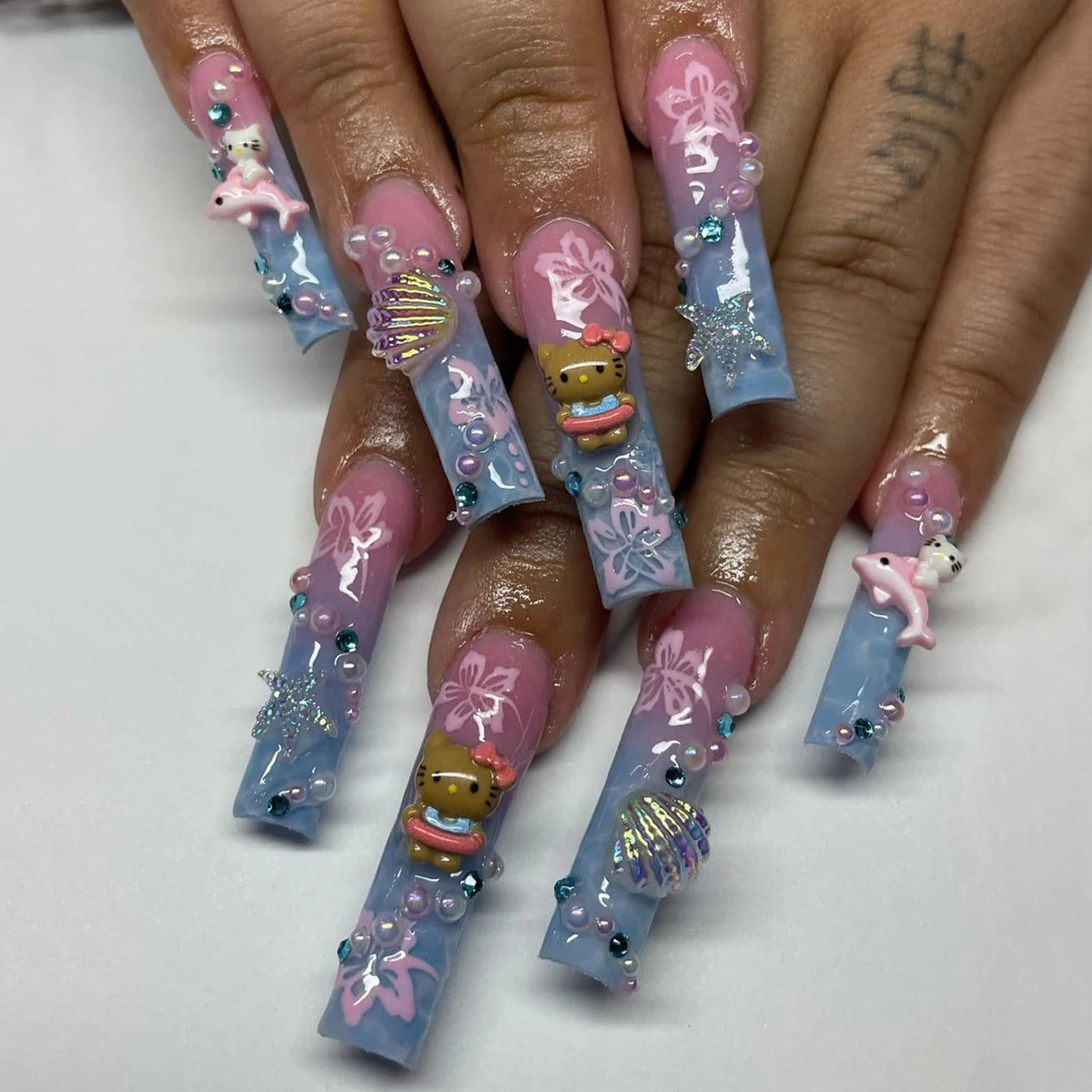 24Pcs Long Coffin-Shaped Nail Stickers in Blue and Pink Gradient, Sanrio French Style Hello Kitty 3D Shell and Starfish Rhinestones, White Pearl Rhinestones, Press-On Nail Set Suitable for Women's Daily Wear and Parties (Incl