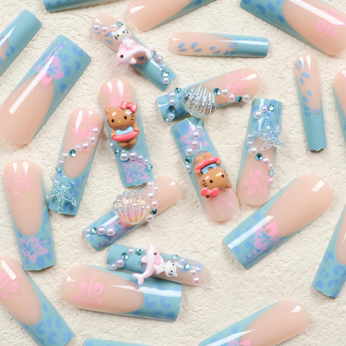 24Pcs Long Coffin-Shaped Nail Stickers in Blue and Pink Gradient, Sanrio French Style Hello Kitty 3D Shell and Starfish Rhinestones, White Pearl Rhinestones, Press-On Nail Set Suitable for Women's Daily Wear and Parties (Incl