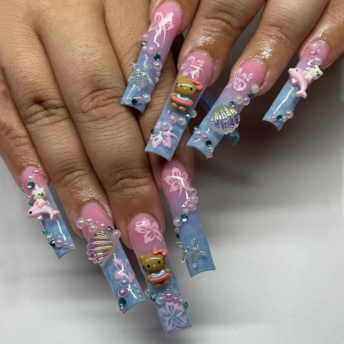 24Pcs Long Coffin-Shaped Nail Stickers in Blue and Pink Gradient, Sanrio French Style Hello Kitty 3D Shell and Starfish Rhinestones, White Pearl Rhinestones, Press-On Nail Set Suitable for Women's Daily Wear and Parties (Incl